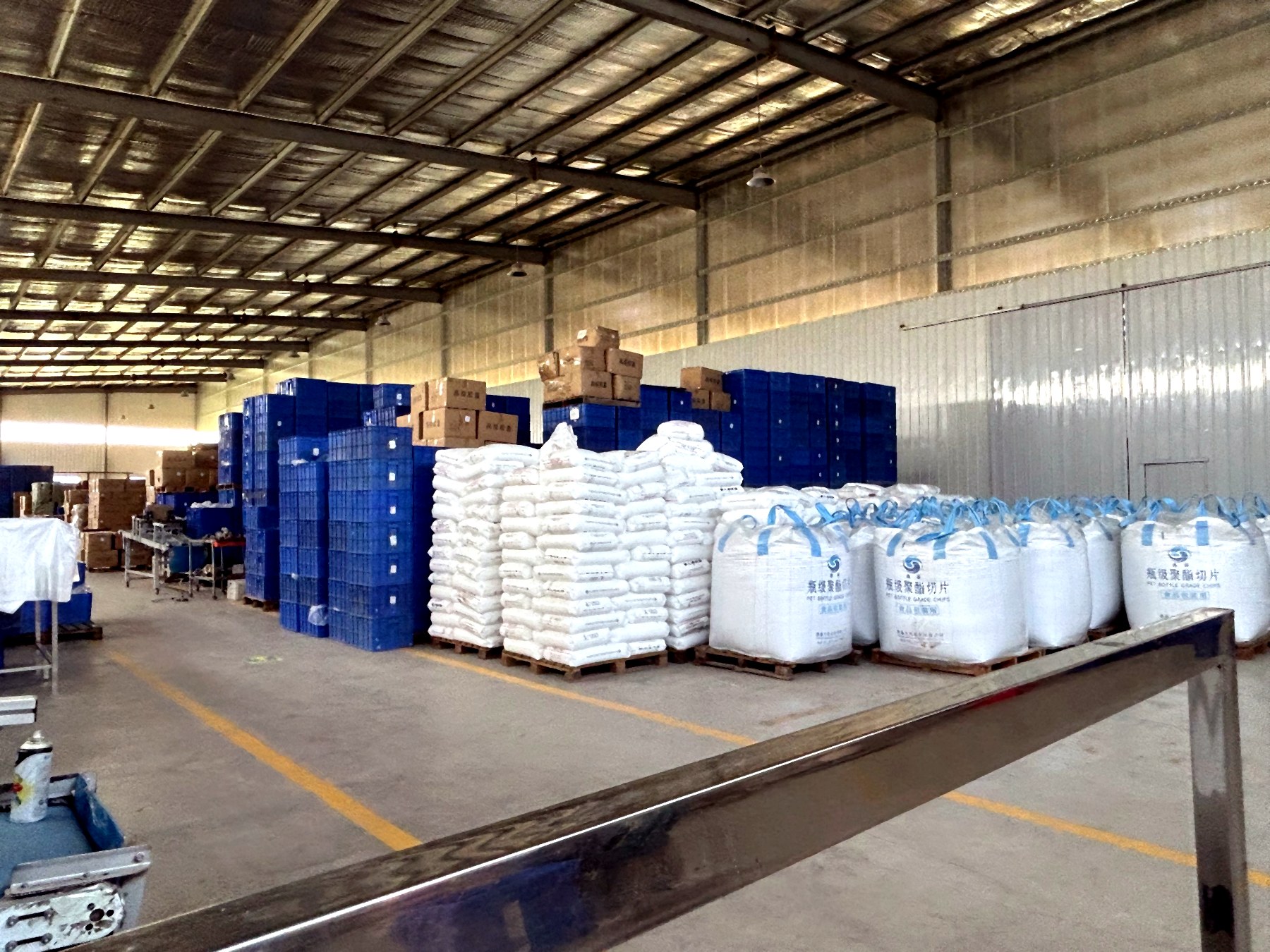 Raw material storage with sacks and crates